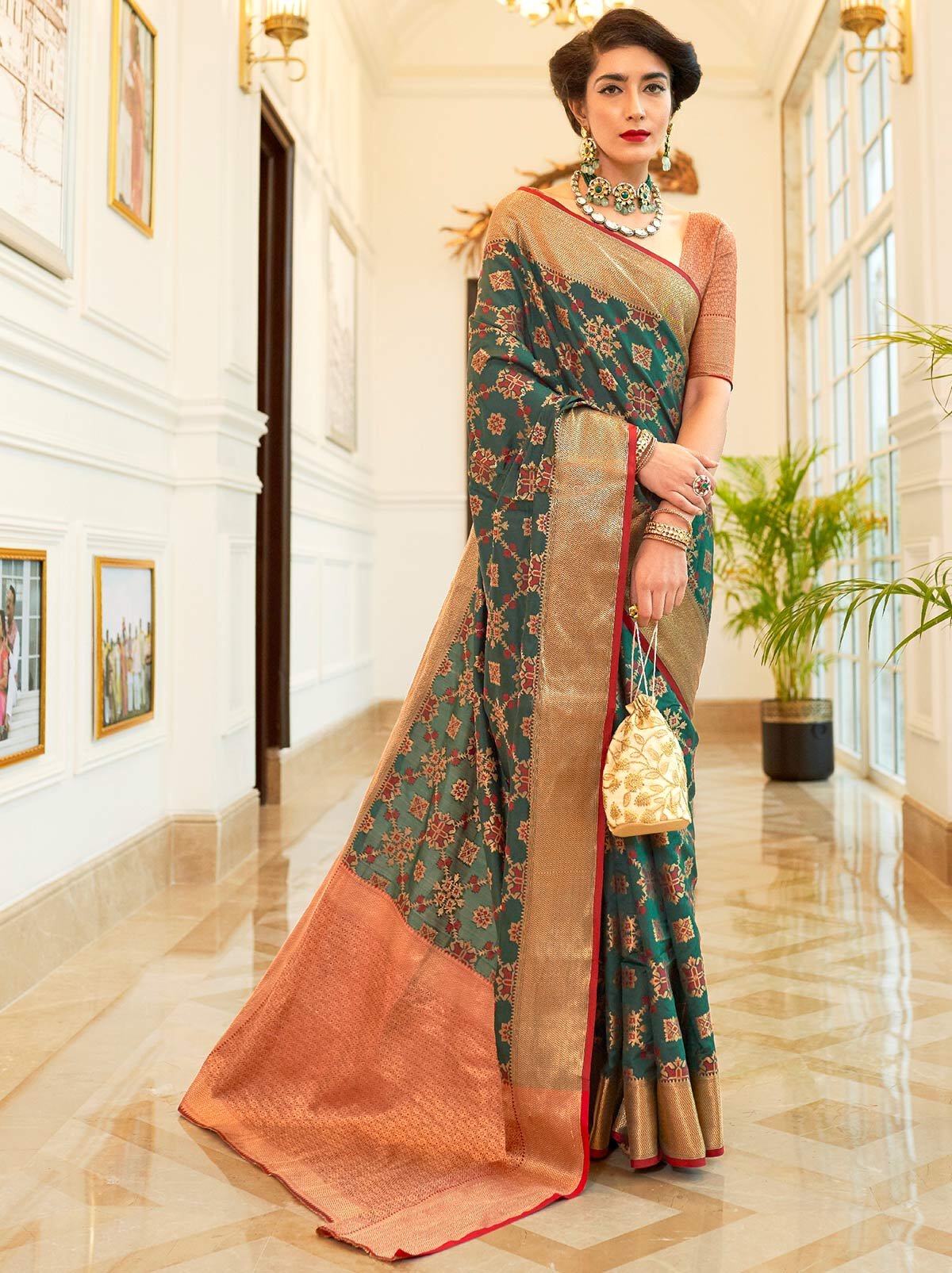 Gorgeously Green Patola Saree With Enchanting Gold Border