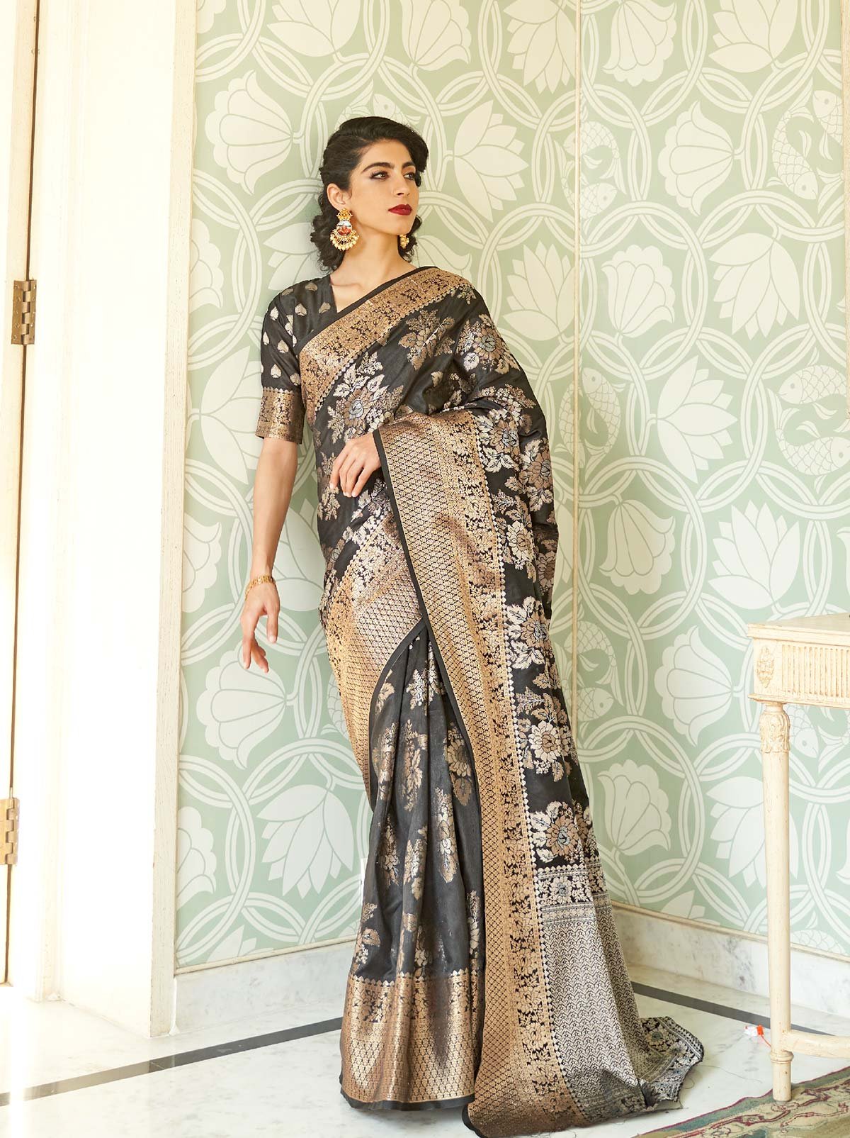 Glamorous Black Banarasi Saree With Heavy Gold Border