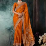 Apricot Orange Premium Fancy Silk Saree With Tassels